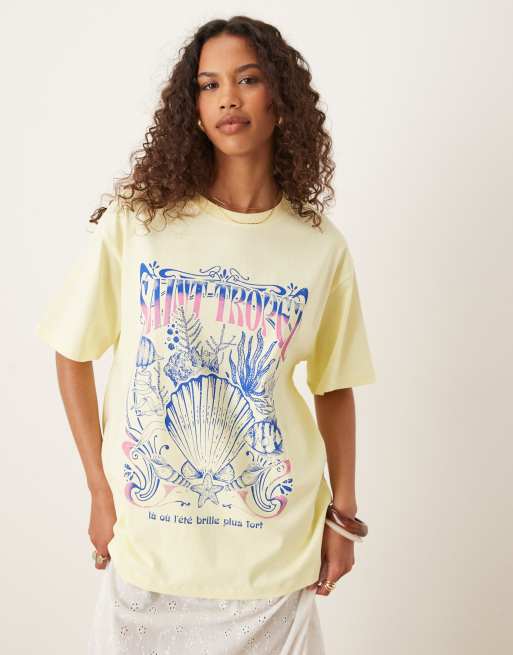 ASOS DESIGN – Jasnożółty T-shirt oversize z grafiką z muszlą i napisem „Saint Tropez”
