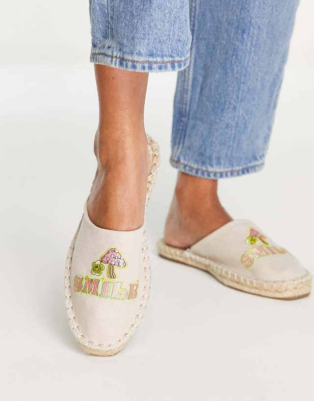 ASOS DESIGN Jax embroidered mules in natural