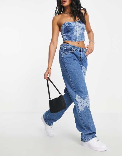 ASOS DESIGN Jean boyfriend baggy taille basse en coton melange avec motif papillons imprime au laser MBLUE ASOS