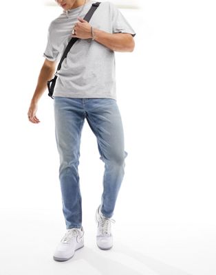 ASOS DESIGN tapered jeans in light wash blue - ASOS Price Checker