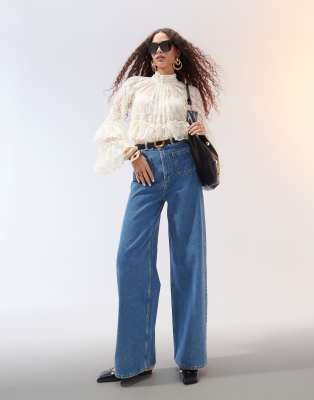 ASOS DESIGN - Jean large épuré avec poches à l'avant - Bleu moyen