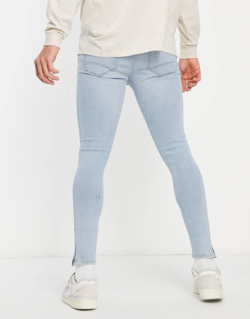 ASOS DESIGN - Jean seconde peau en tissu power stretch avec déchirures aux genoux et ourlets zippés - Bleu clair délavé, 2 de 4