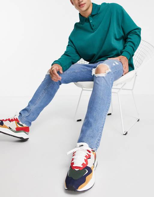 ASOS DESIGN - Jean slim ultra déchiré à ourlet franc - Bleu délavé moyen