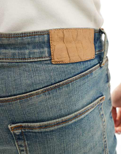 ASOS DESIGN - Jeans a zampa con strappi sulle ginocchia blu vintage tinto, 3 di 5
