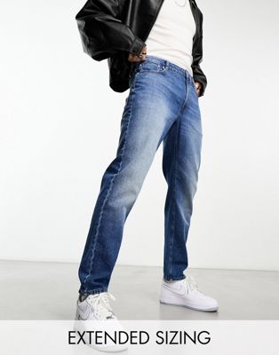 ASOS DESIGN tapered jeans in mid wash blue - ASOS Price Checker