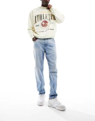 ASOS DESIGN tapered jeans in mid wash blue - ASOS Price Checker