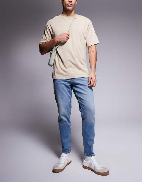 ASOS DESIGN - Jeans affusolati elasticizzati lavaggio medio con tinta vintage - view 1