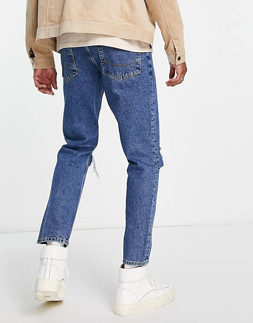 Asos Uomo Abbigliamento Pantaloni e jeans Jeans Jeans affosulati Jeans affusolati lavaggio medio con strappi sulle ginocchia 