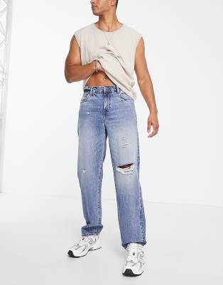 Jeans ampi lavaggio chiaro con strappi sulle ginocchia-Blu - ASOS DESIGN jeans uomo Blu