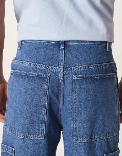 ASOS DESIGN wide skater jeans with cargo pockets in mid wash blue
