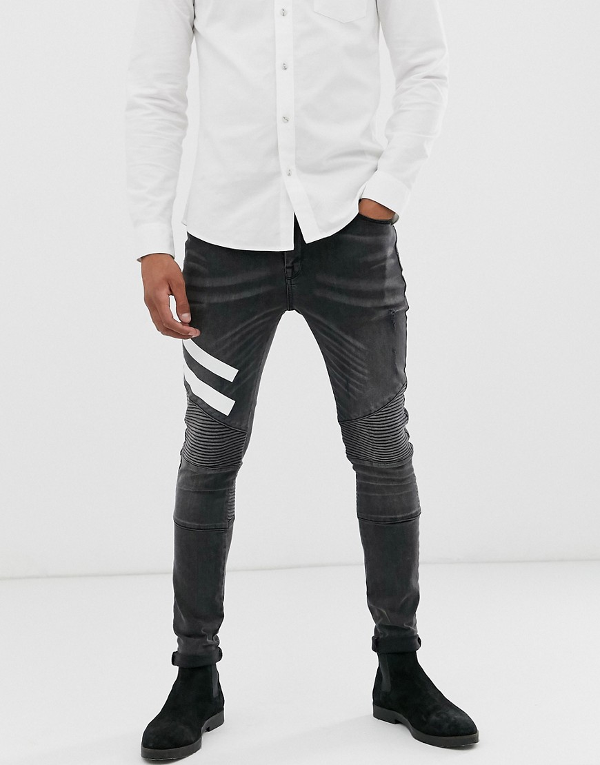 ASOS DESIGN - Jeans biker super skinny nero slavato con stampa bianca