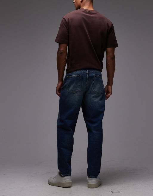 ASOS DESIGN - Jeans comodi affusolati in blu slavato, 2 di 5