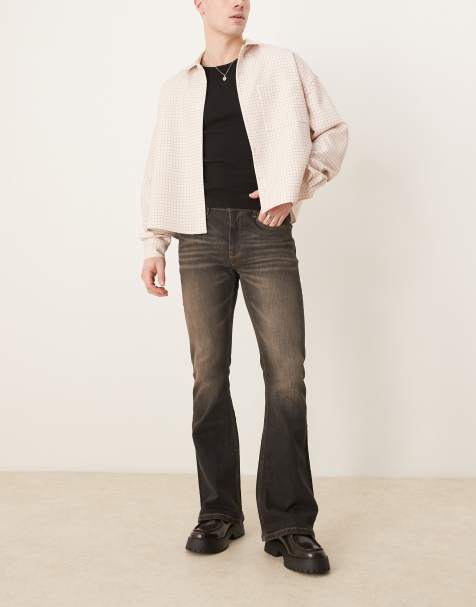 ASOS DESIGN - Jeans elasticizzati a zampa nero slavato con tinta marrone - view 1