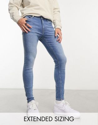 ASOS DESIGN power stretch jeans in mid wash blue - ASOS Price Checker
