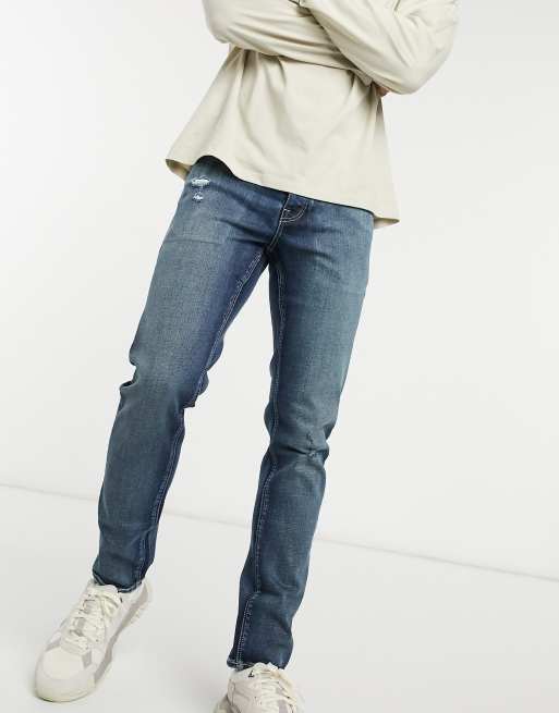 ASOS DESIGN - Jeans elasticizzati lavaggio giapponese scuro vintage con abrasioni