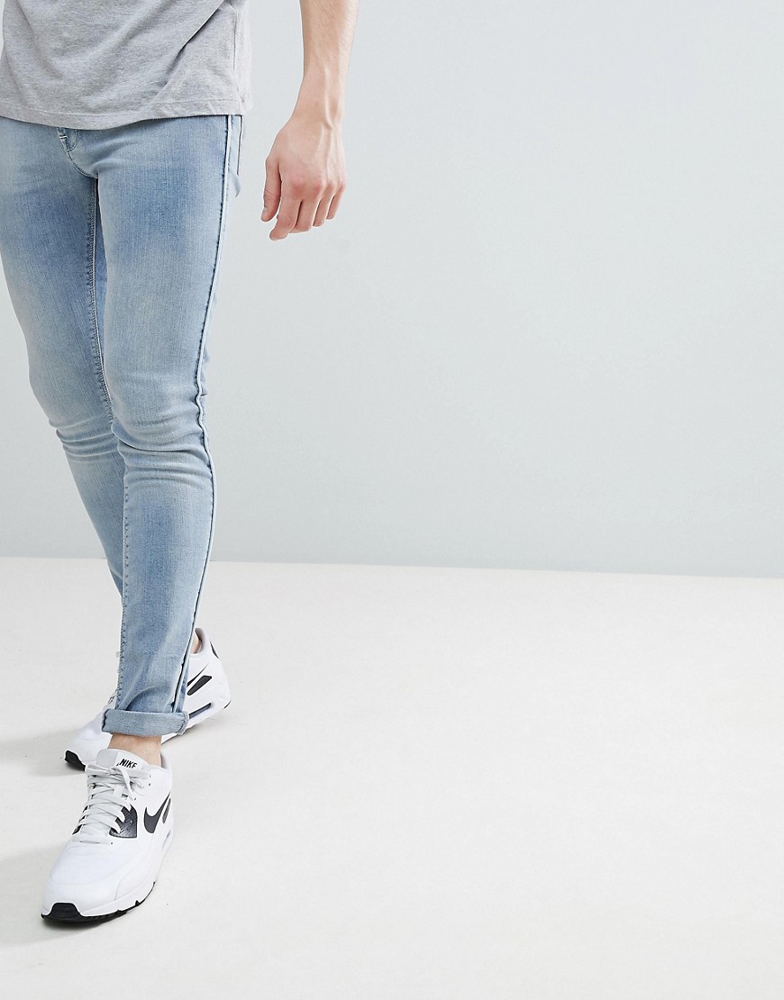 ASOS DESIGN - Jeans extreme skinny blu lavaggio chiaro con profili