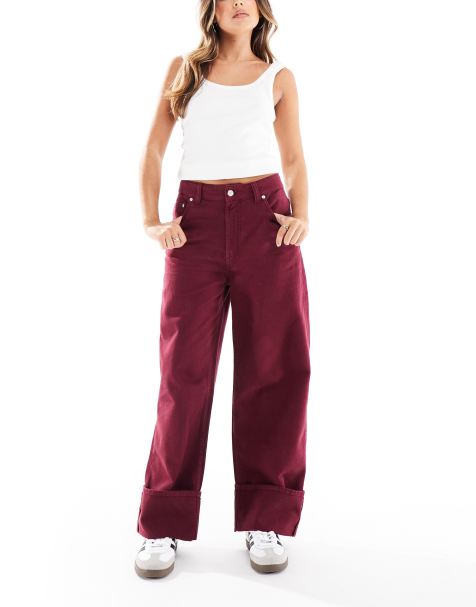 ASOS DESIGN – Jeans in Burgunderrot mit Saumaufschlag - view 1