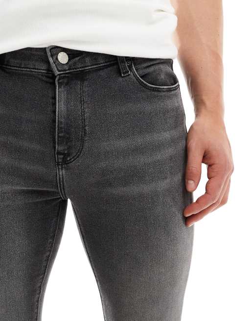 ASOS DESIGN - Jeans in power stretch nero slavato effetto spray, 3 di 5
