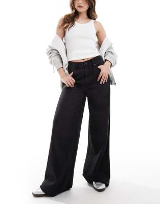 ASOS DESIGN - Jeans in verwaschenem Schwarz mit weitem Bein