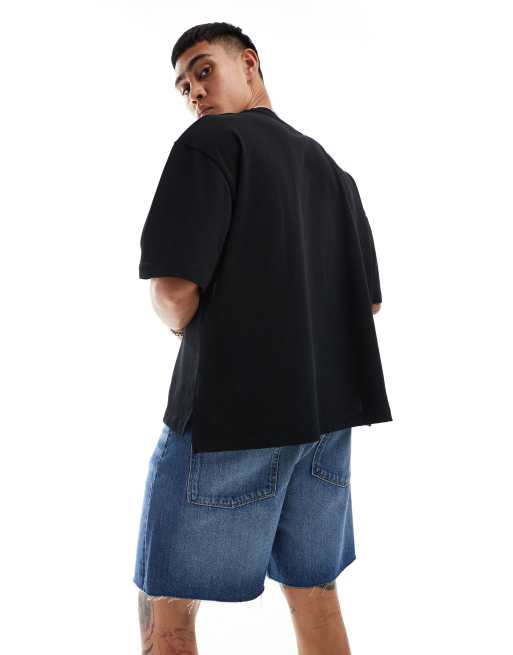 ASOS DESIGN – Jeans-Jorts in normaler Länge in mittelblauer Waschung mit offenkantigem Saum, 3 von 5