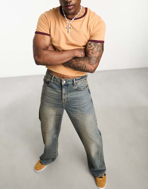 ASOS DESIGN Jeans larghi con fondo ampio tinti vintage