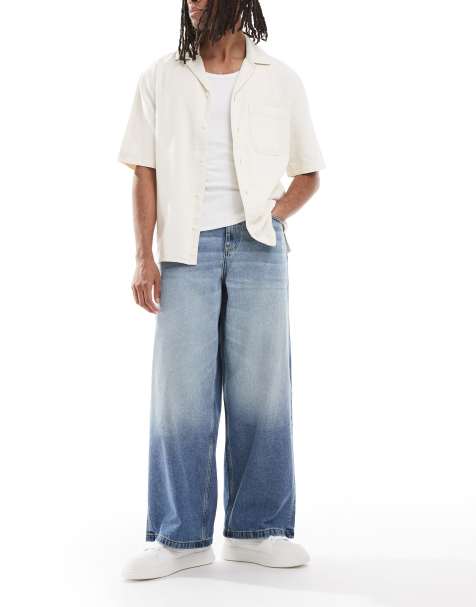 ASOS DESIGN - Jeans med superposet pasform i blå mellemvask med farveskær - view 1