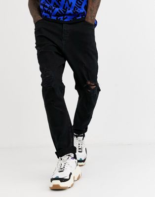 ASOS DESIGN - Jeans met laag kruis en grote scheuren, in zwarte wassing
