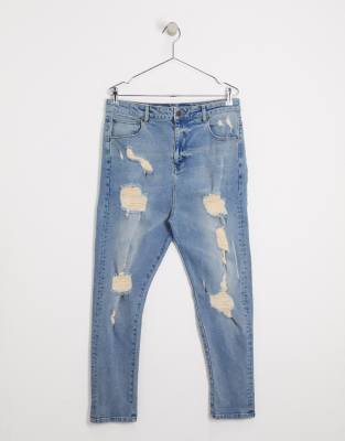 ASOS DESIGN - Jeans met laag kruis, vintage lichtblauwe wassing en grote  scheuren | ASOS