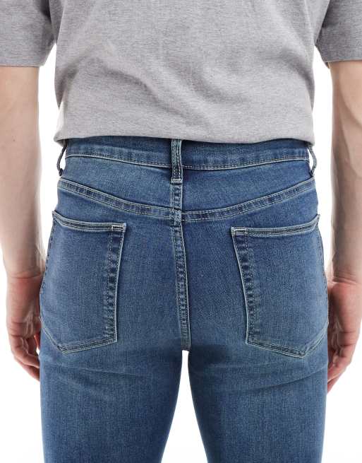 ASOS DESIGN - Jeans met powerstretch in blauw met donkere wassing, 4 van 5