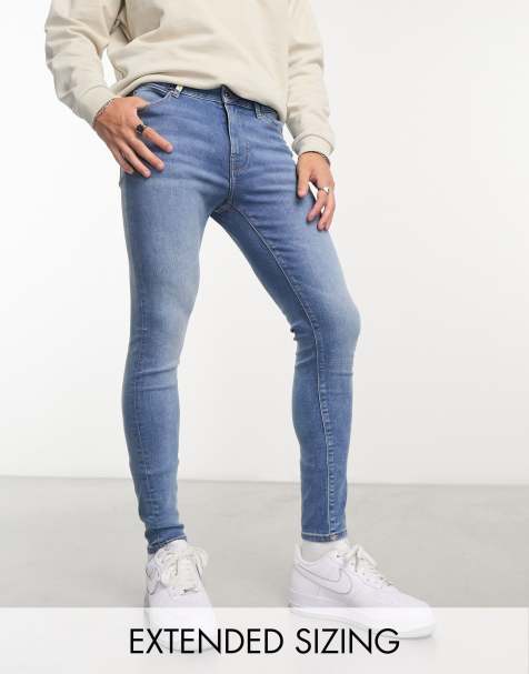 ASOS DESIGN - Jeans met powerstretch in mid-wash blauw - view 1