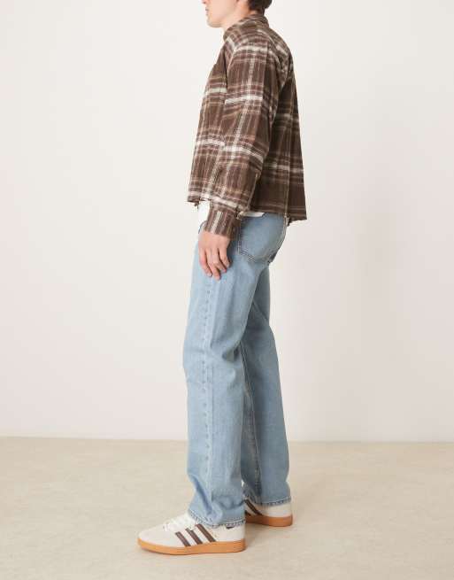 ASOS DESIGN straight leg jeans in mid wash blue