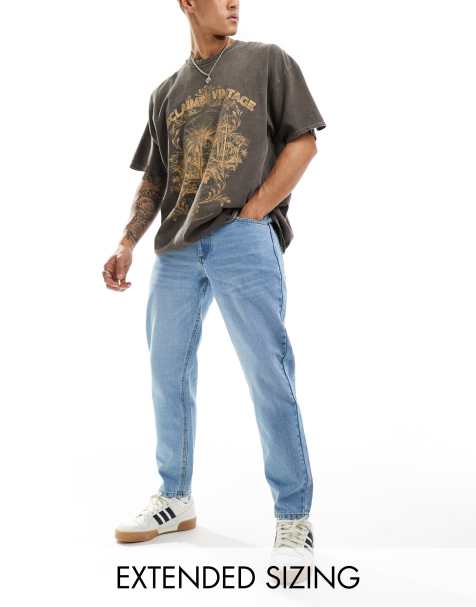 ASOS DESIGN - Jeans met smaltoelopende pasvorm in blauw met lichte wassing - view 1