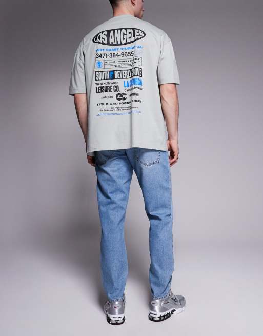 ASOS DESIGN - Jeans met smaltoelopende pasvorm in blauw met lichte wassing, 2 van 5