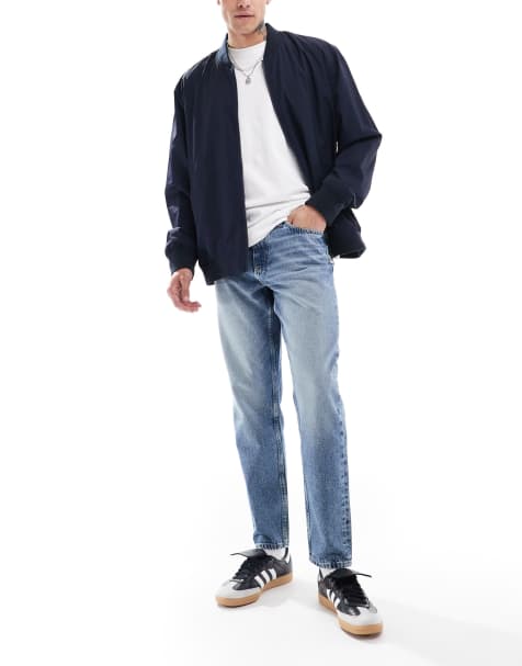 ASOS DESIGN - Jeans met smaltoelopende pijpen in mid-wash blauw - view 1