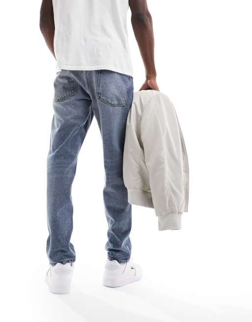 ASOS DESIGN - Jeans met toelopende pasvorm in jaren 00 blauwe wassing , 2 van 5