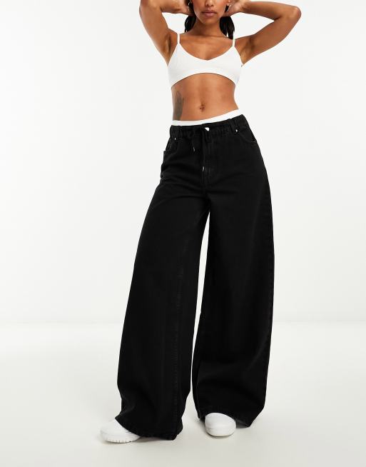 ASOS DESIGN - Jeans met wijde pijpen en elastische taille in zwart met wassing