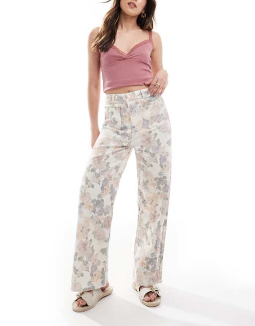 ASOS DESIGN - Jeans met wijde pijpen, zakken aan de voorkant en bloemenprint