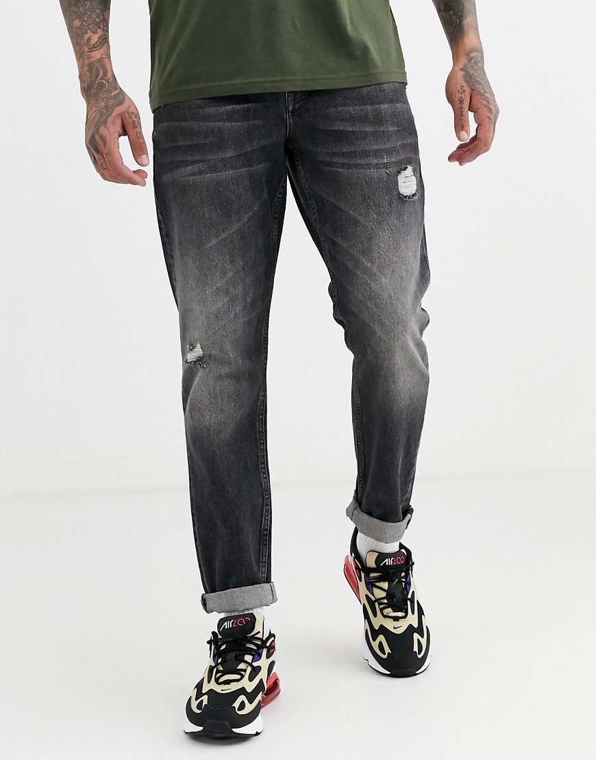 ASOS DESIGN - Jeans rigidi slim nero slavato con abrasioni