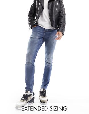ASOS DESIGN skinny jeans with abrasions in mid wash blue - ASOS Price Checker