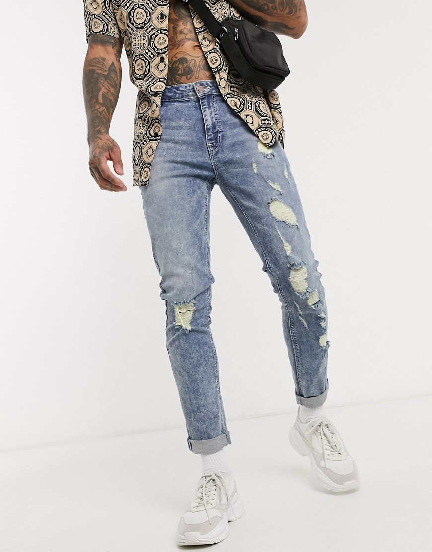 ASOS DESIGN - Jeans skinny lavaggio marmorizzato con strappi vistosi-Blu