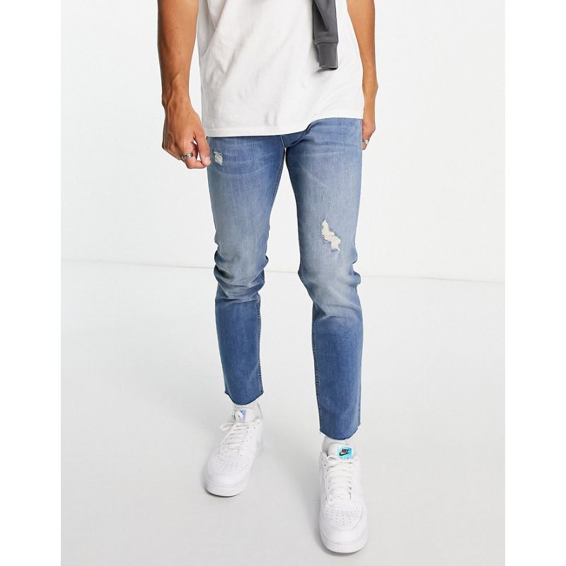 DESIGN - Jeans skinny lavaggio medio con abrasioni e fondo grezzo