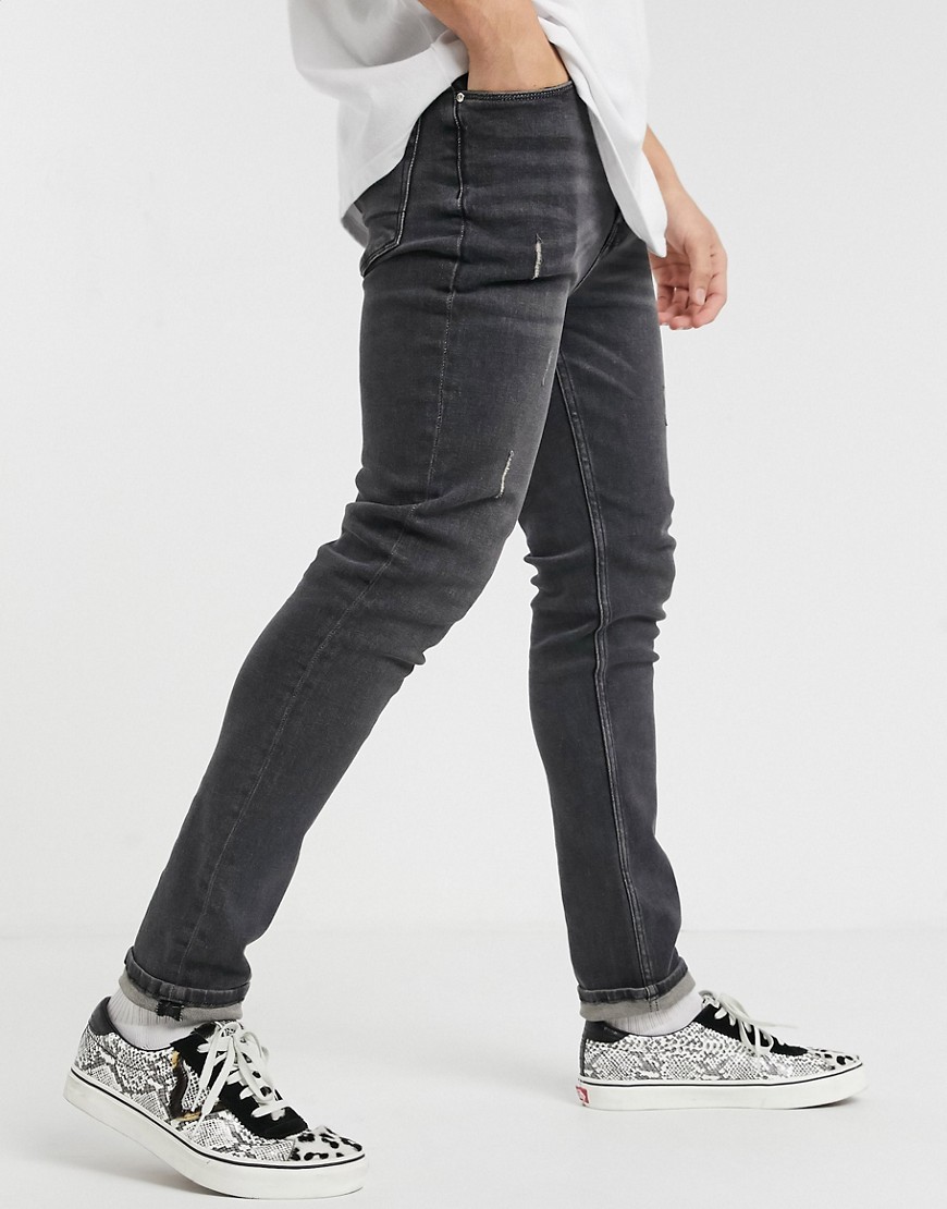 ASOS DESIGN - Jeans skinny nero slavato con abrasioni