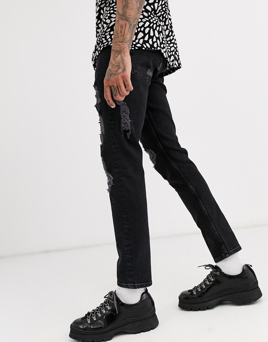 ASOS DESIGN - Jeans slim nero slavato con strappi vistosi