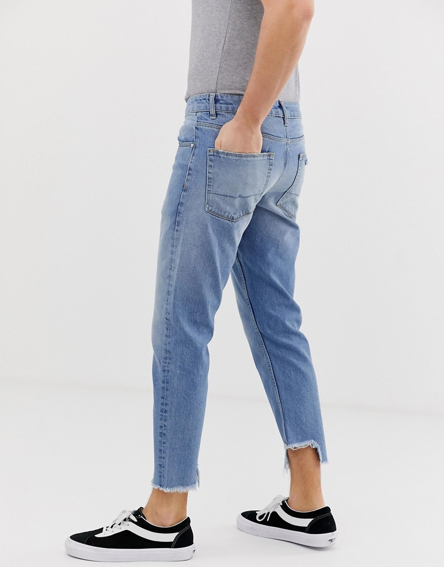 ASOS DESIGN - Jeans slim vintage lavaggio chiaro blu con fondo asimmetrico