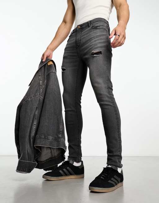 ASOS DESIGN - Jeans spray on elasticizzati nero slavato con strappi