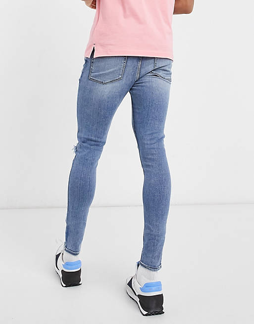 Jeans spray on power stretch con strappi sulle ginocchia lavaggio scuro da Uomo di ASOS in Blu Uomo Abbigliamento da Jeans da Jeans a sigaretta 