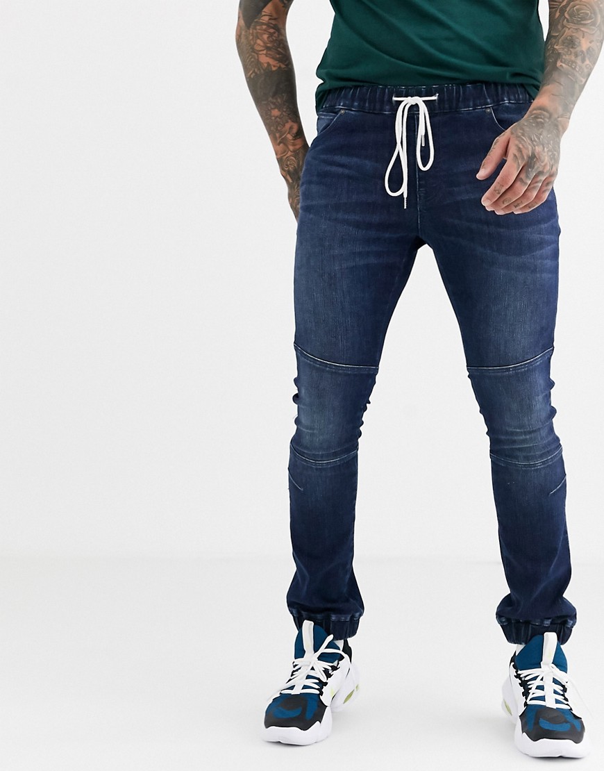 ASOS DESIGN - Jeans stile joggers super skinny con dettagli stile motociclista lavaggio blu scuro