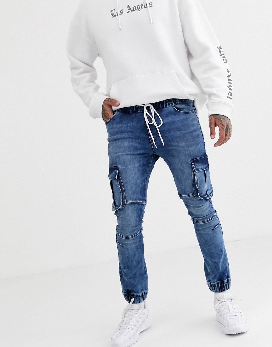 ASOS DESIGN - Jeans stile joggers super skinny lavaggio blu medio