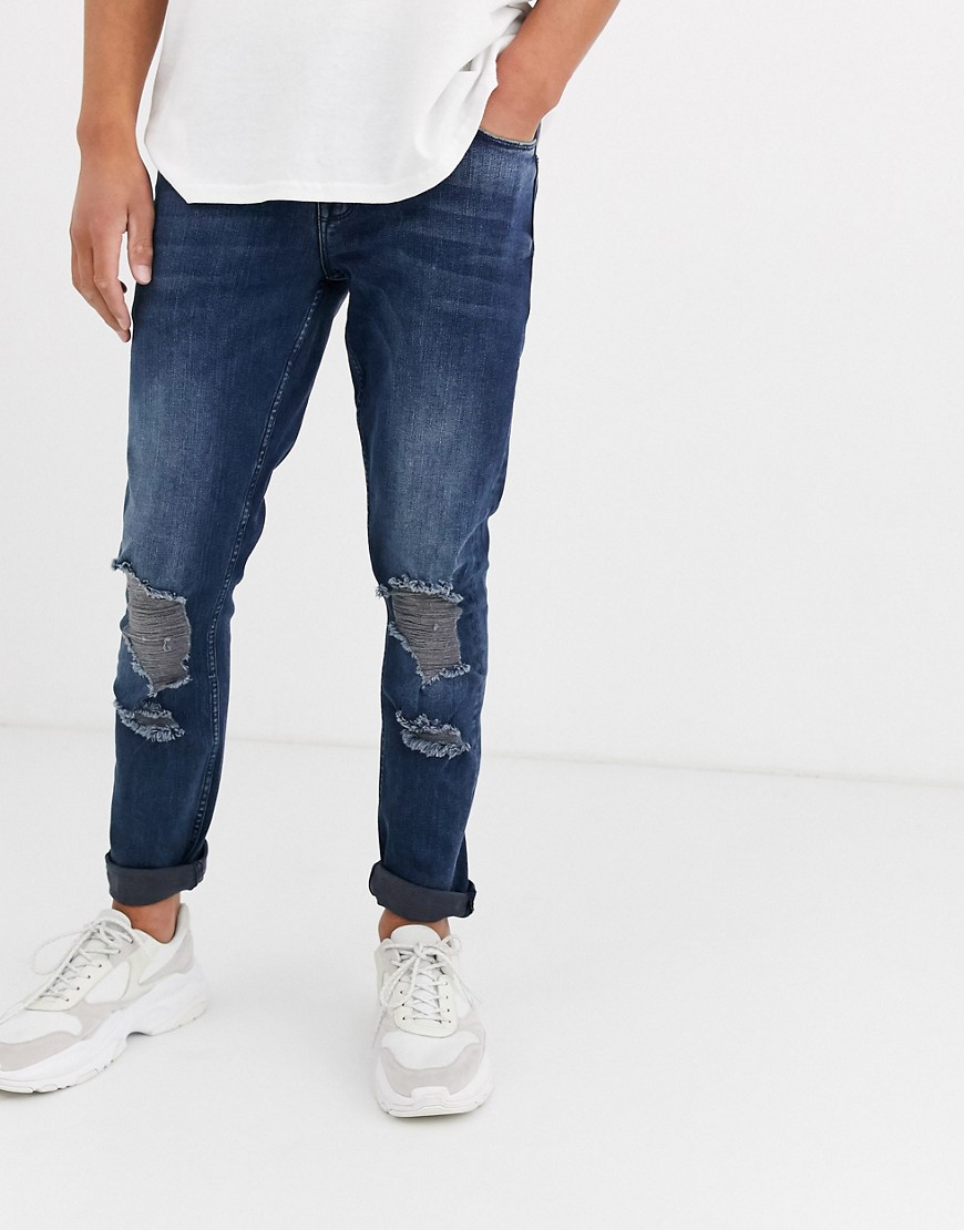 ASOS DESIGN - Jeans stretch slim blu nero con ginocchio strappato