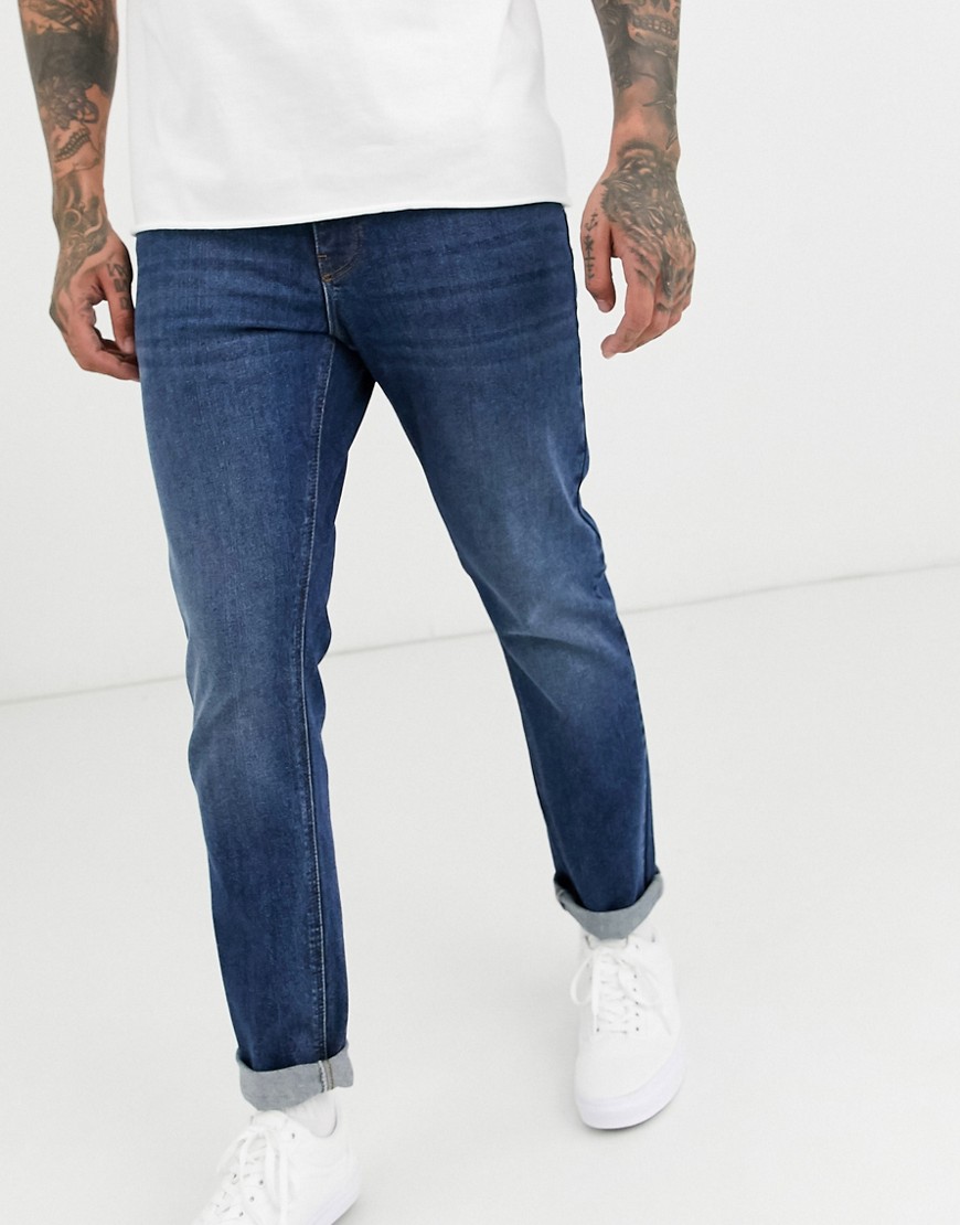 ASOS DESIGN - Jeans stretch slim lavaggio blu scuro